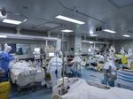 Medical personnel work in the intensive care unit of a hospital designated for COVID-19 patients in Wuhan on Feb. 24, 2020.