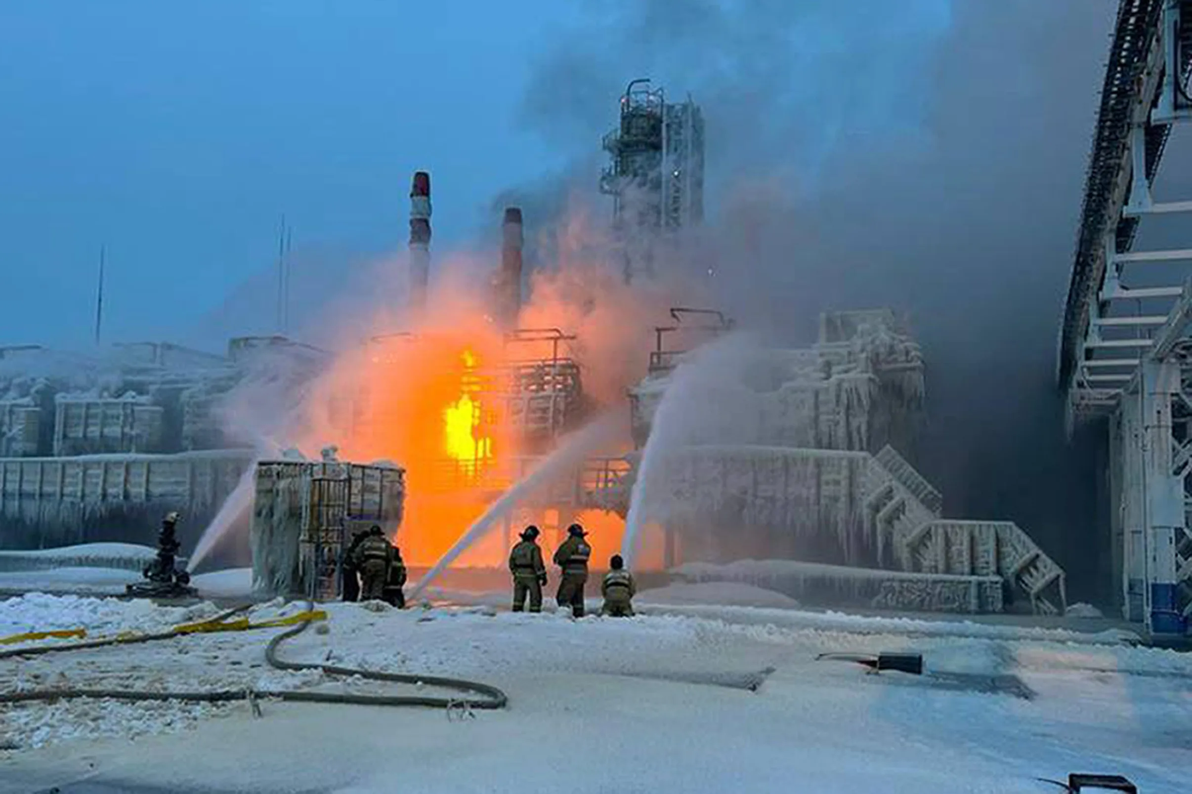 Firefighters extinguish the blaze at a Novatek plant in Ust-Luga, Russia, on Jan. 21.