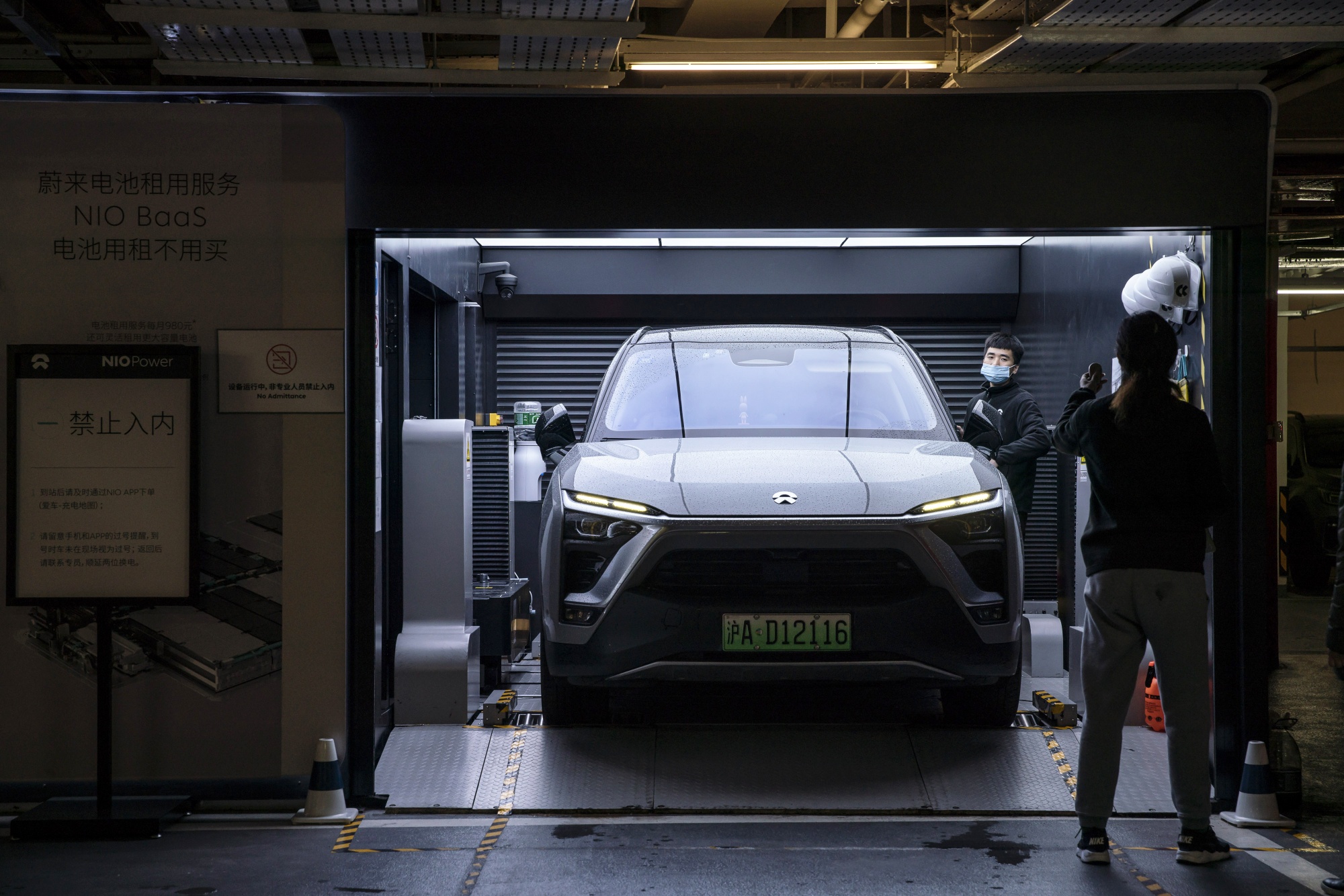 A Nio Inc. ES6 electric vehicle at a battery swap station in Shanghai.