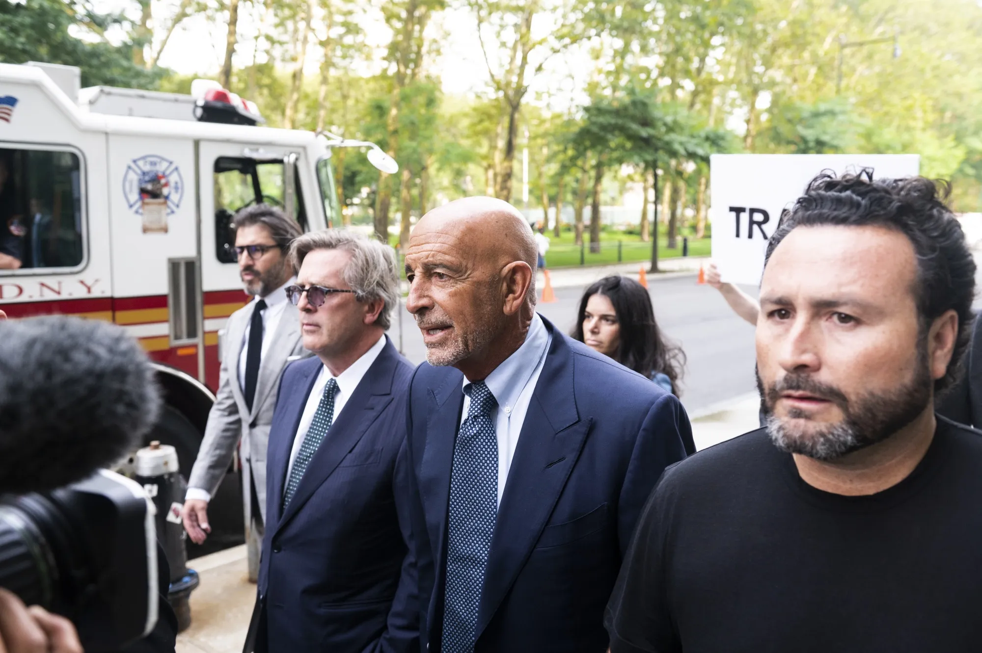 Tom Barrack Jr., center, arrives at criminal court in New York, on July 26, 2021.