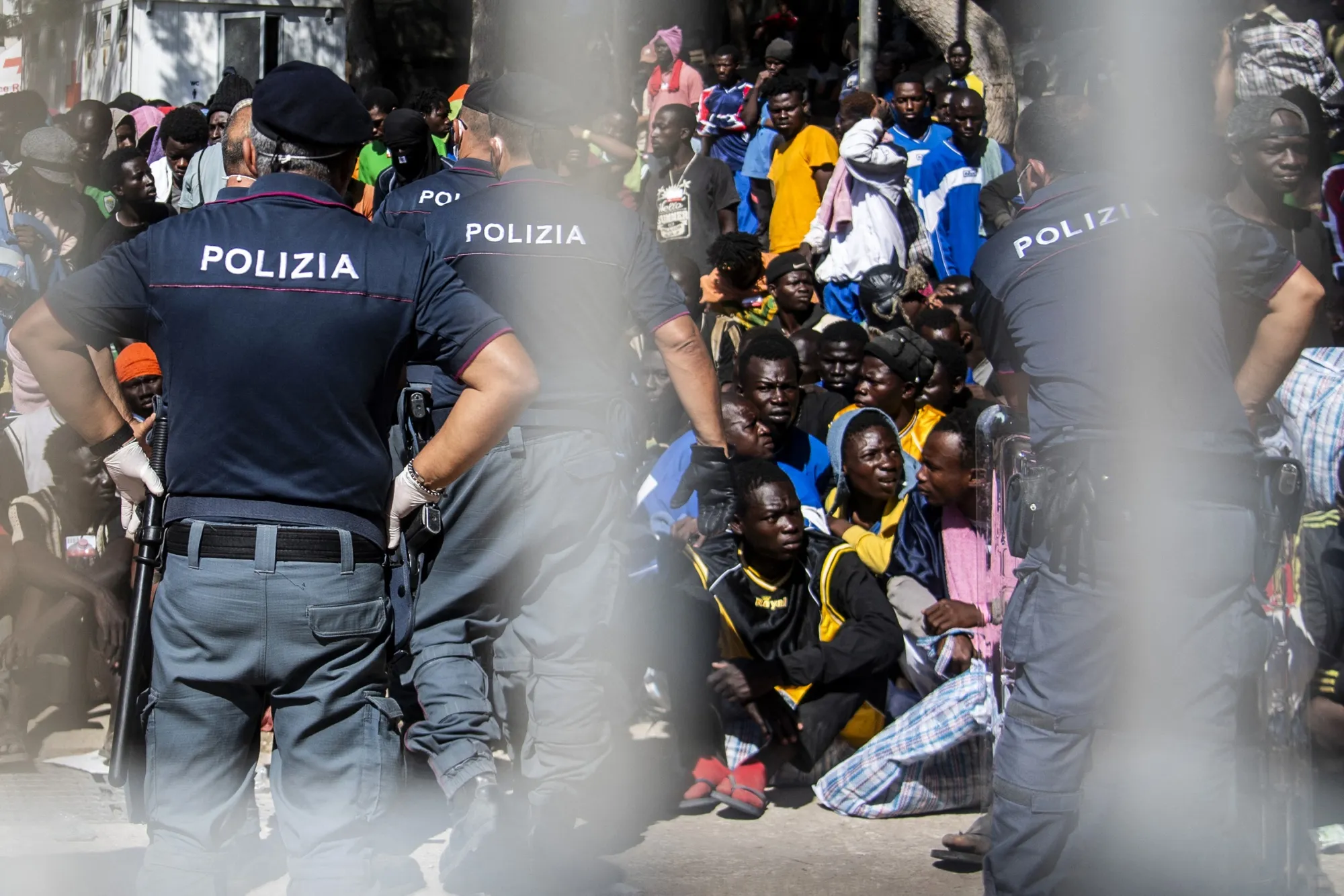 Migrants gather outside the operational centre, on the island of Lampedusa, on Sept.&nbsp;14.