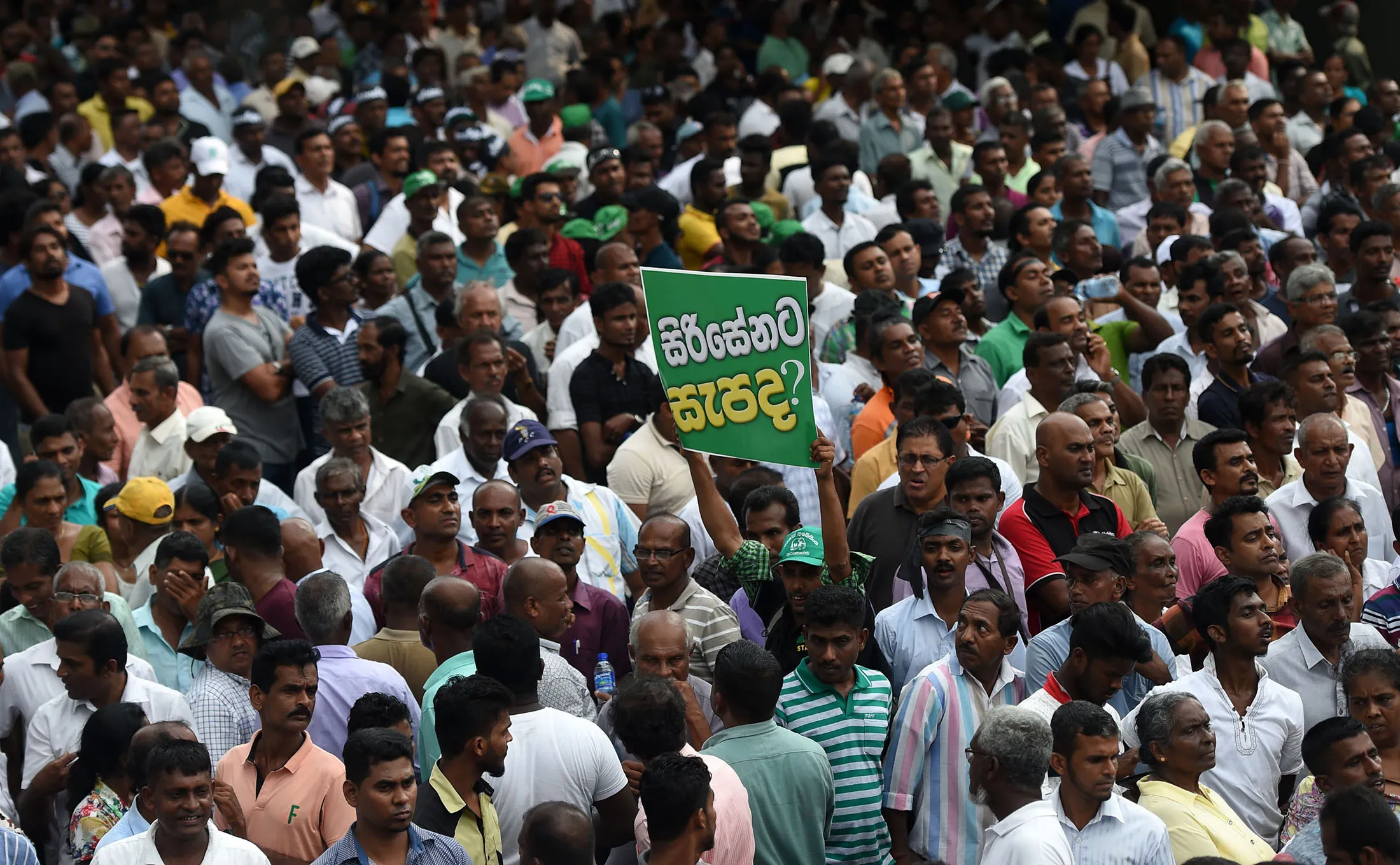 Ranil Wickremesinghe's supporters protest in Colombo on Oct. 30.