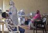 A healthcare worker screens a person at a Covid-19 test center in Mumbai on Sept. 16.