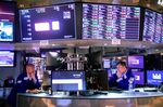 Traders on the floor of the New York Stock Exchange (NYSE) in New York, U.S., on Monday, June 27, 2022. Money managers betting on a sustained global rebound will be left sorely disappointed in the second half of this crushing year as a protracted bear market looms, even if inflation cools.