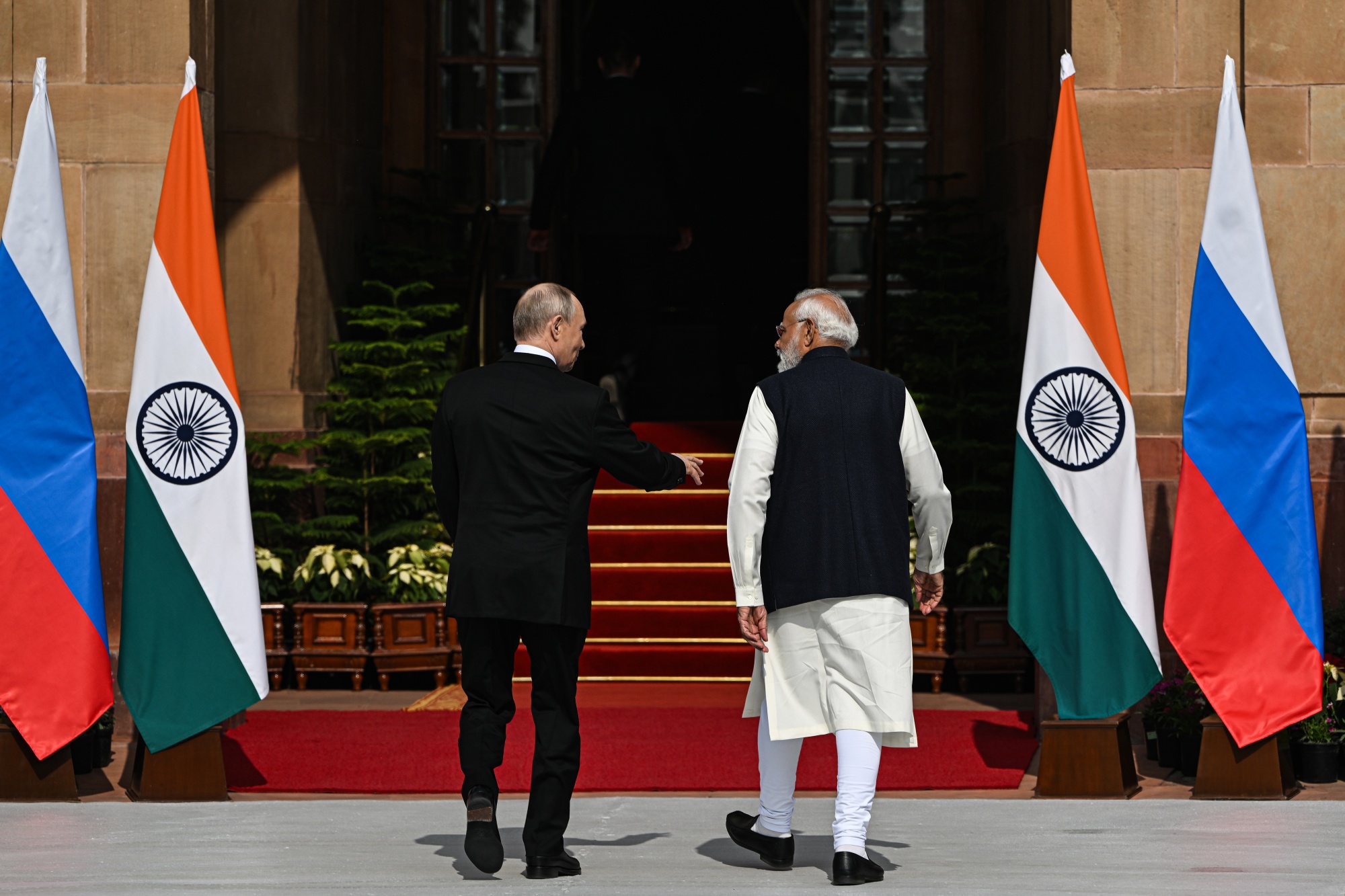 Vladimir Putin, Russia's president, left, and Narendra Modi, India's prime minister, at Hyderabad House in New Delhi, India, on Friday, Dec. 5, 2025. Modi and Putin held a bilateral meeting in New Delhi, as the two leaders look to deepen economic cooperation in the face of pressure from US President Donald Trump. Photographer: Prakash Singh/Bloomberg