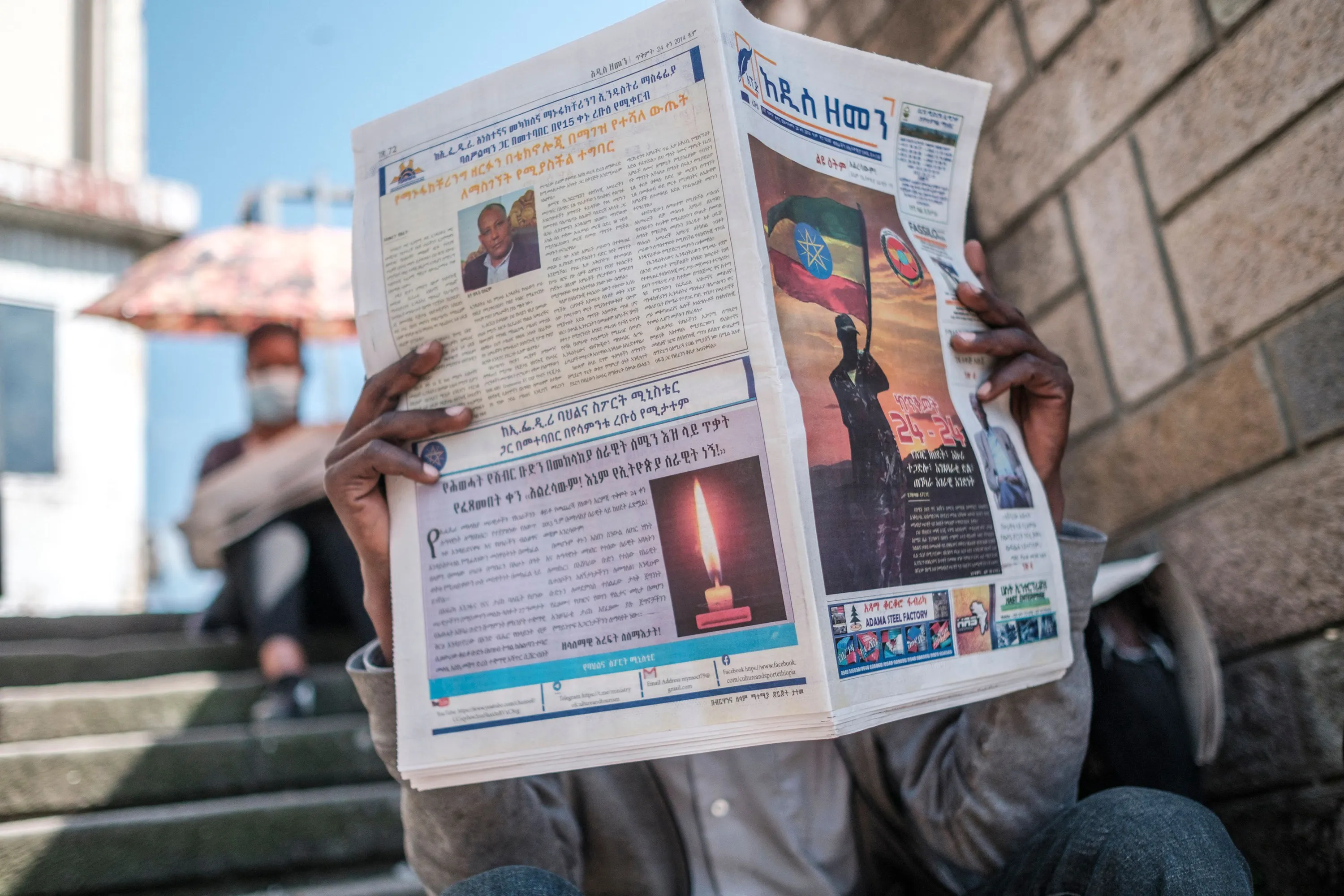 A man reads a newspaper in&nbsp;Addis Ababa, Ethiopia, on Nov. 3.