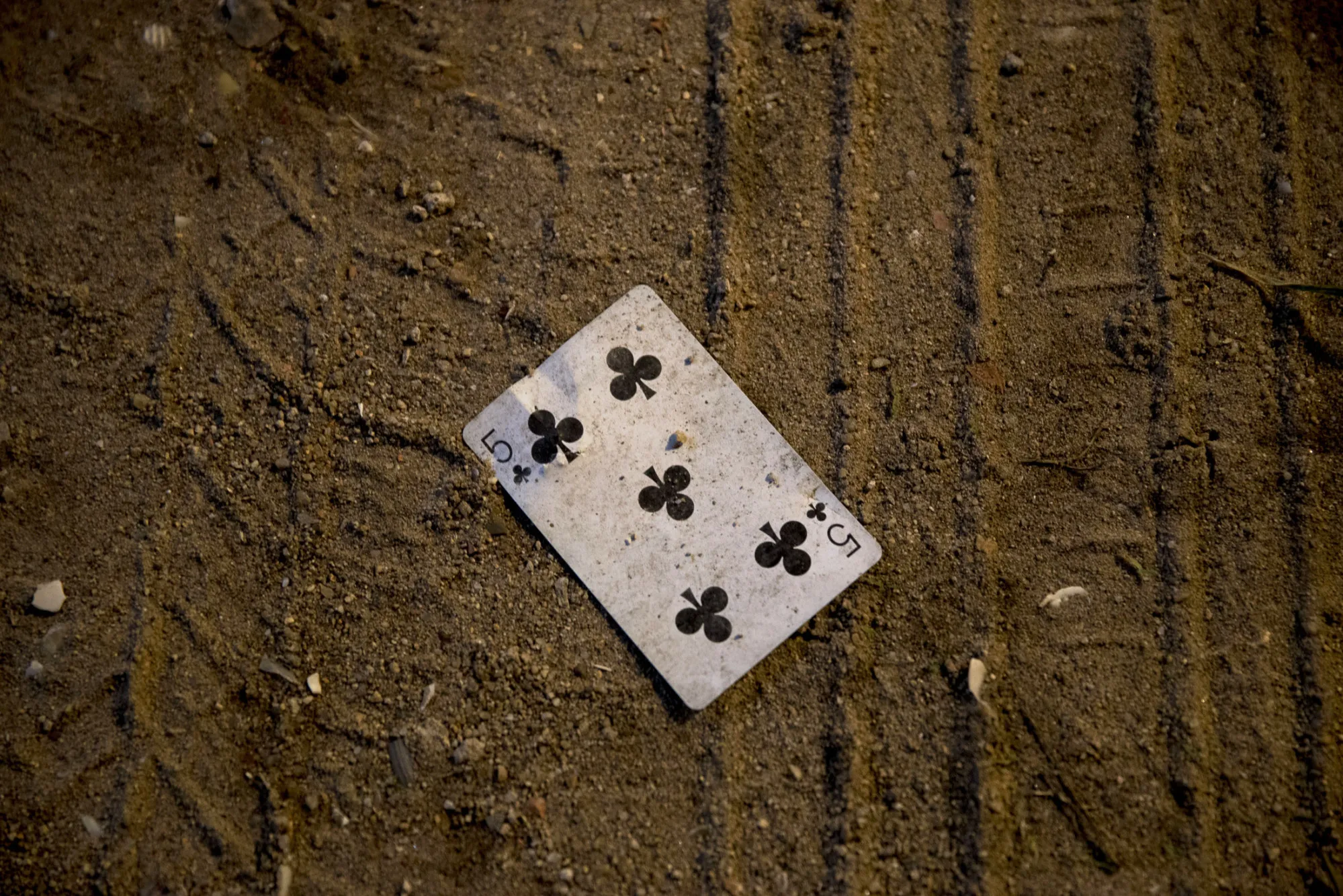 A discarded playing card lies on a street in Sihanoukville, Cambodia.