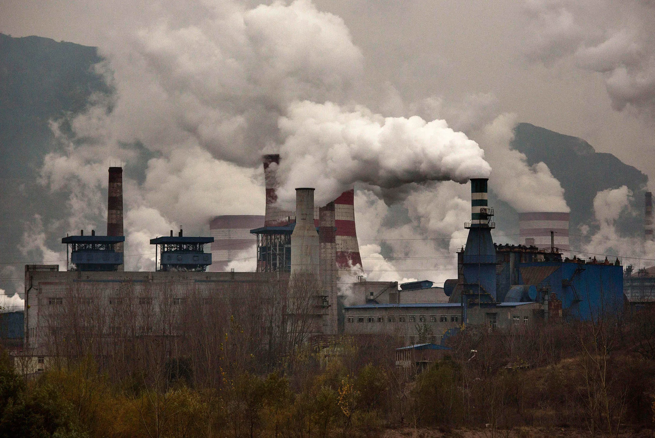 Smoke billows from smokestacks at a steel factory in the industrial province of Hebei.

