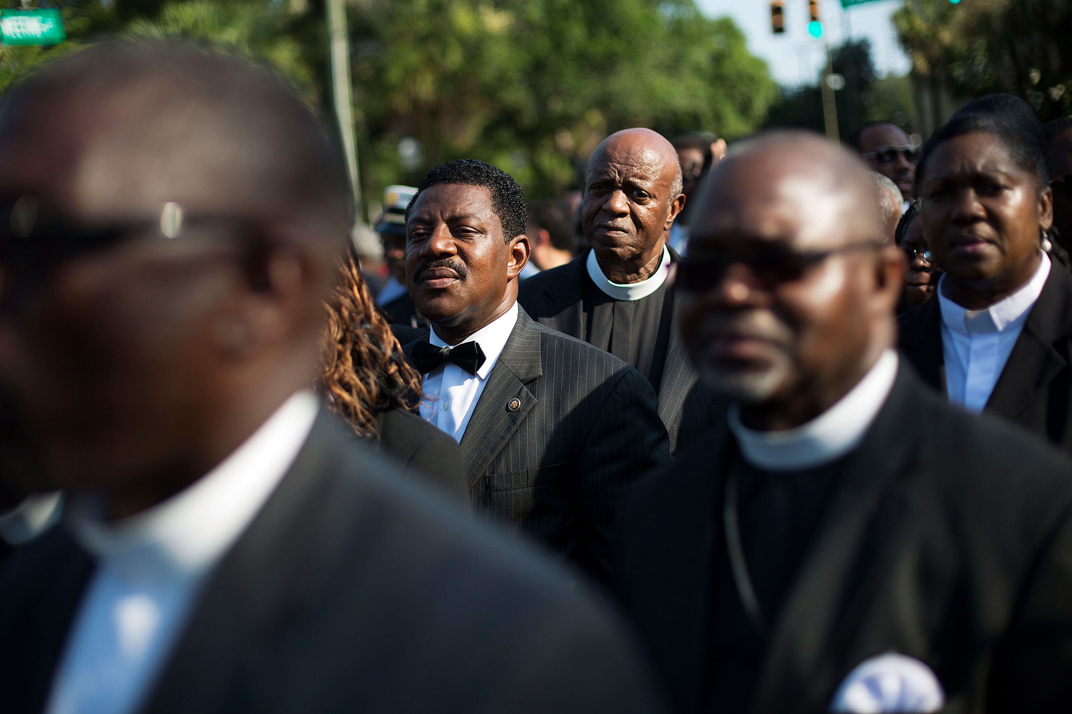 Clergy members wait to enter the funeral service for Sen. Clementa Pinckney, Friday, June 26, 2015, in Charleston, S.C. President Barack Obama will deliver the eulogy at Pinckney's funeral at a college arena near the Emanuel AME Church, the scene of last week's shooting.
