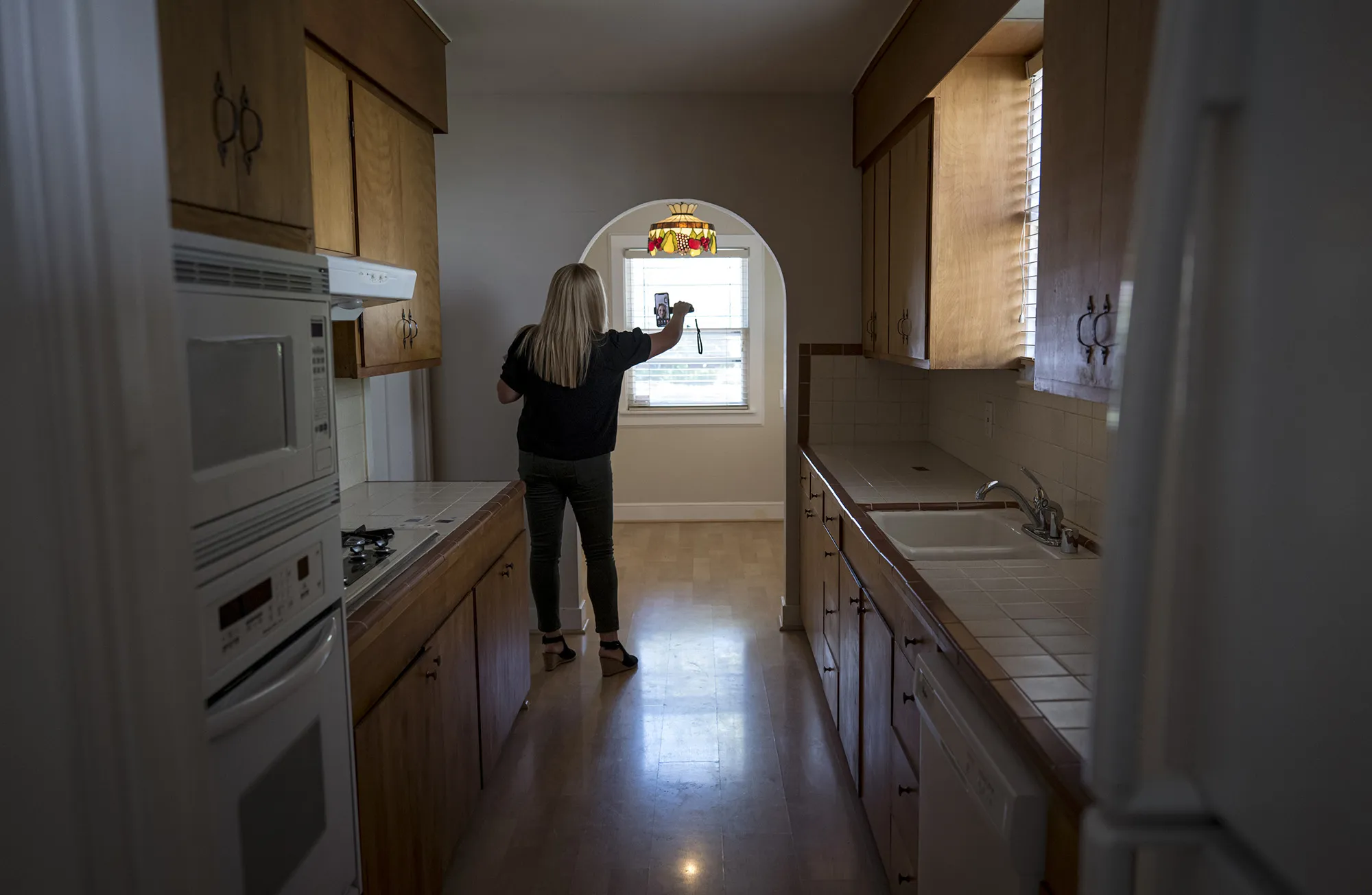 A realtor provides a virtual video tour of a home for sale in Sacramento, California.