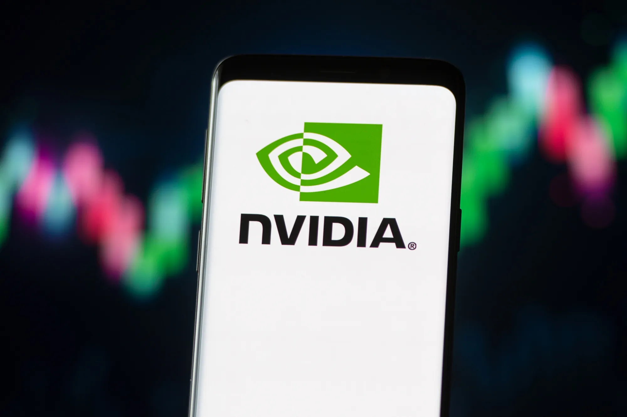 In this photo illustration a Nvidia logo seen displayed on a