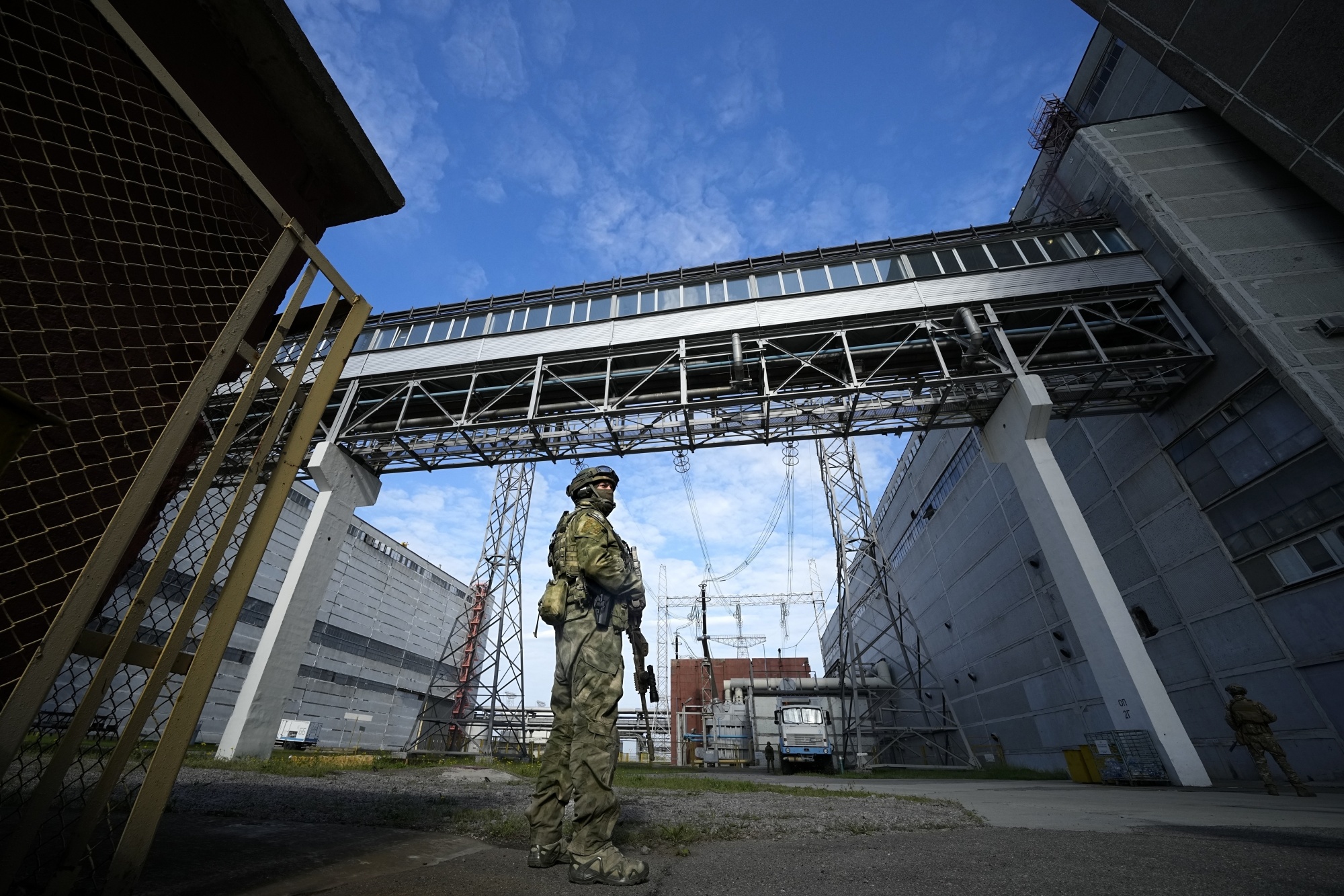 A Russian soldier guards Zaporizhzhia nuclear power station&nbsp;in southeastern Ukraine.
