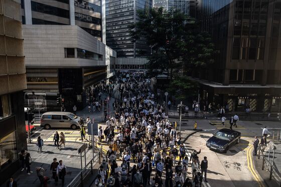 Hong Kong Police Fire Warning Shot After Death Fuels Clashes