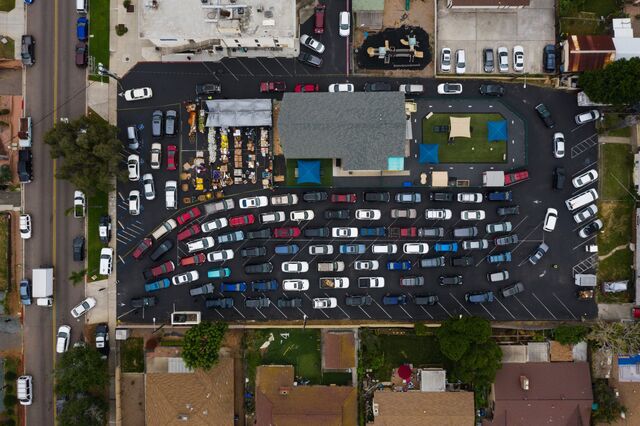 A food bank gives families approximately 30 pounds of food and products including toilet paper, paper towels and baby wipes in Chula Vista, California, in May, 2020. 