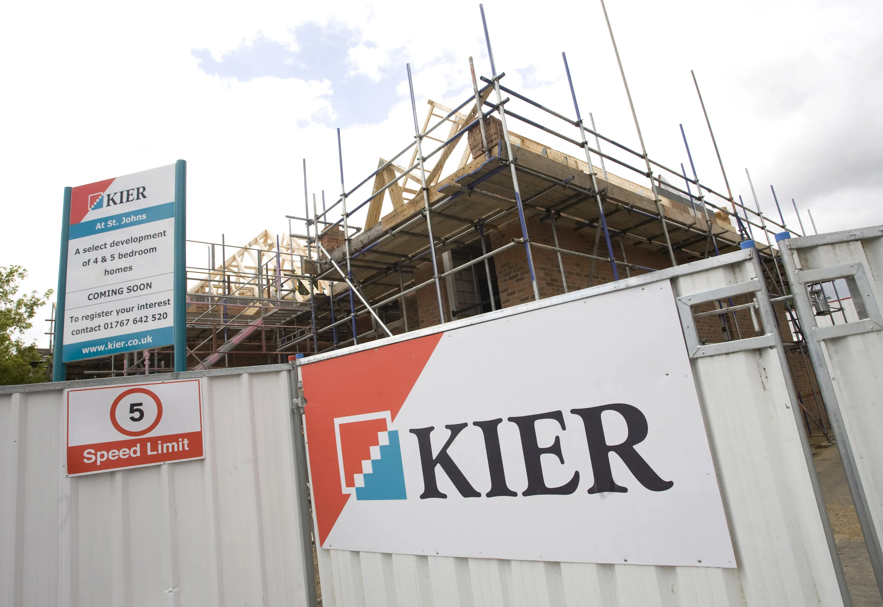 The Kier logo sits on a sign at a construction site for residential housing by Kier Group Plc.