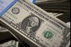 Stacks of U.S. one-dollar bills are arranged for a photograph in New York, U.S.
