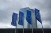 The stars of the European Union (EU) sit on banners flying outside the European Central Bank