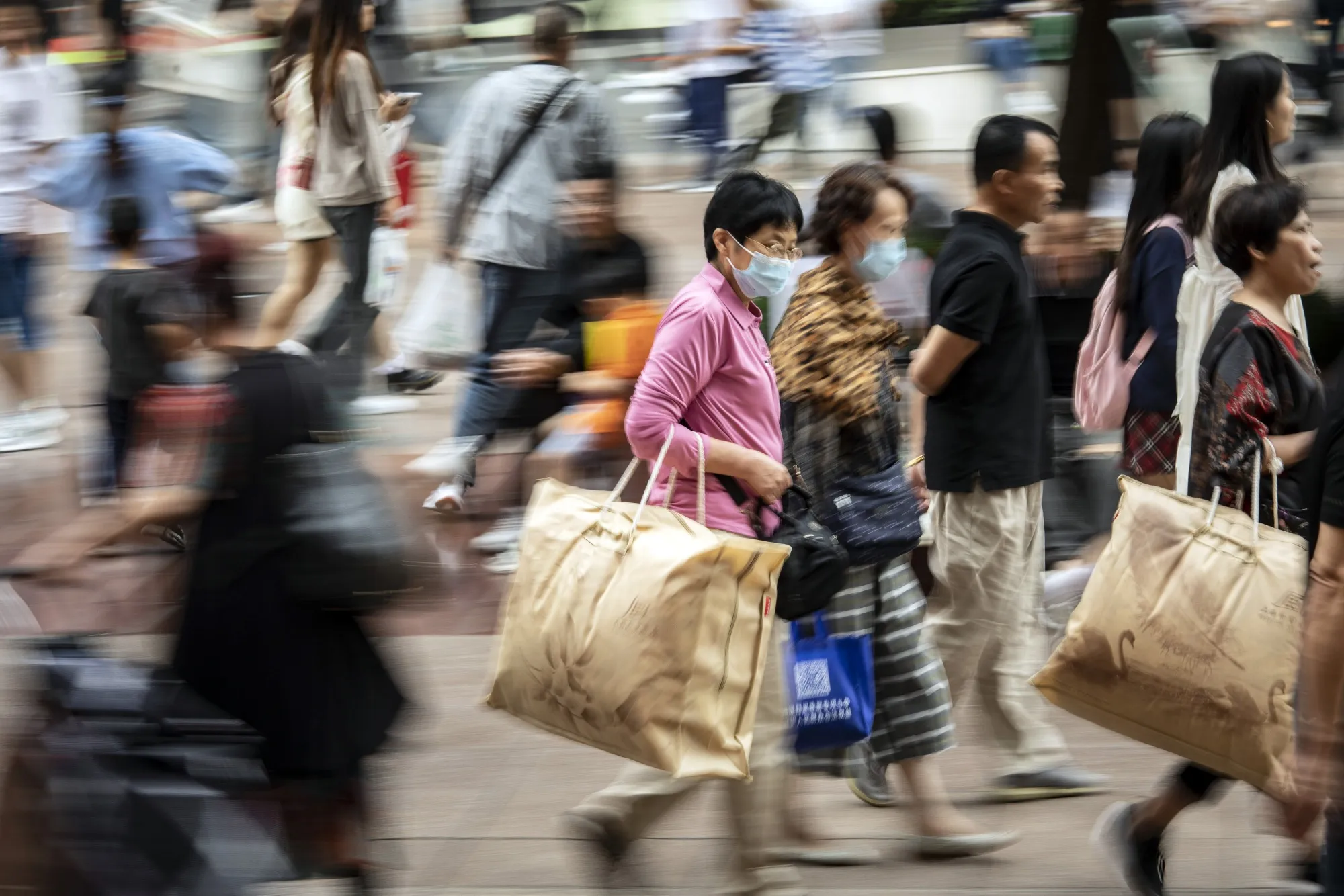 Shoppers on Nanjing Road shopping street in Shanghai, China.