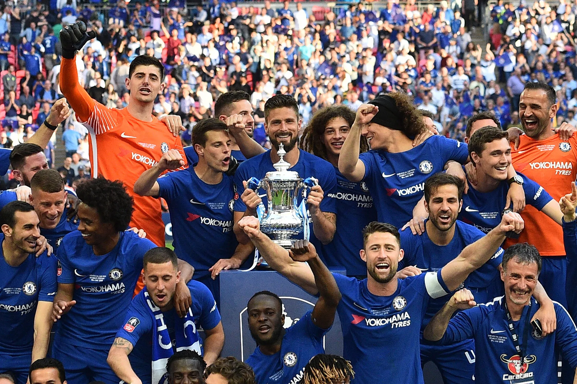 Chelsea players celebrate with the trophy after their victory in the English FA Cup on May 19.