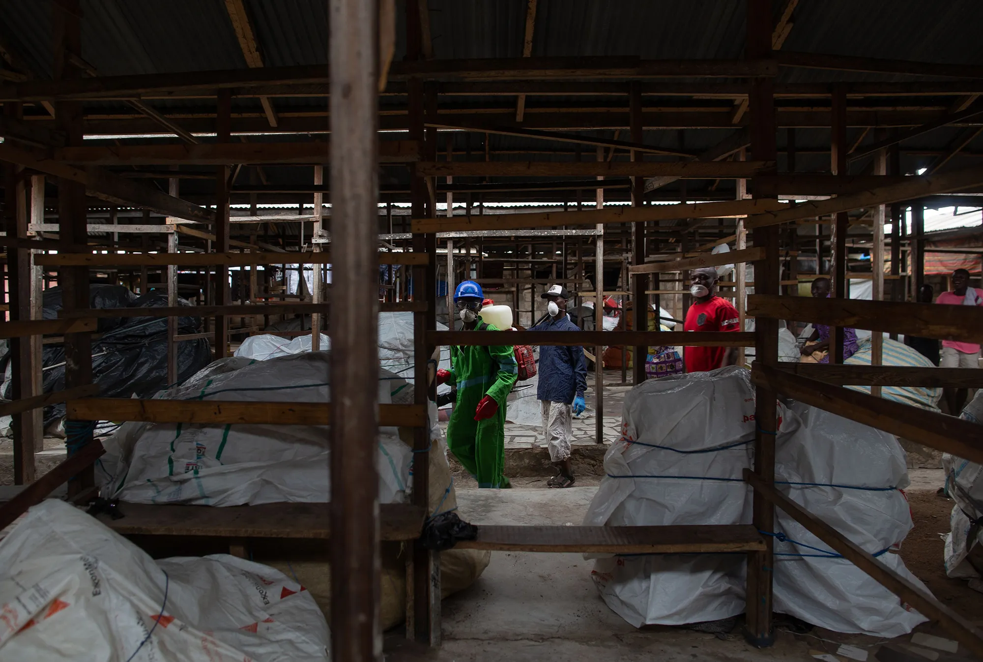 A city worker disinfects a market as a preventive measure in Accra on March 23.