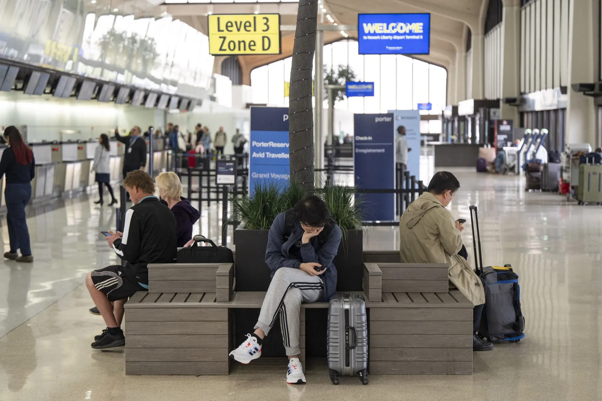 Travelers at Newark Liberty International Airport.