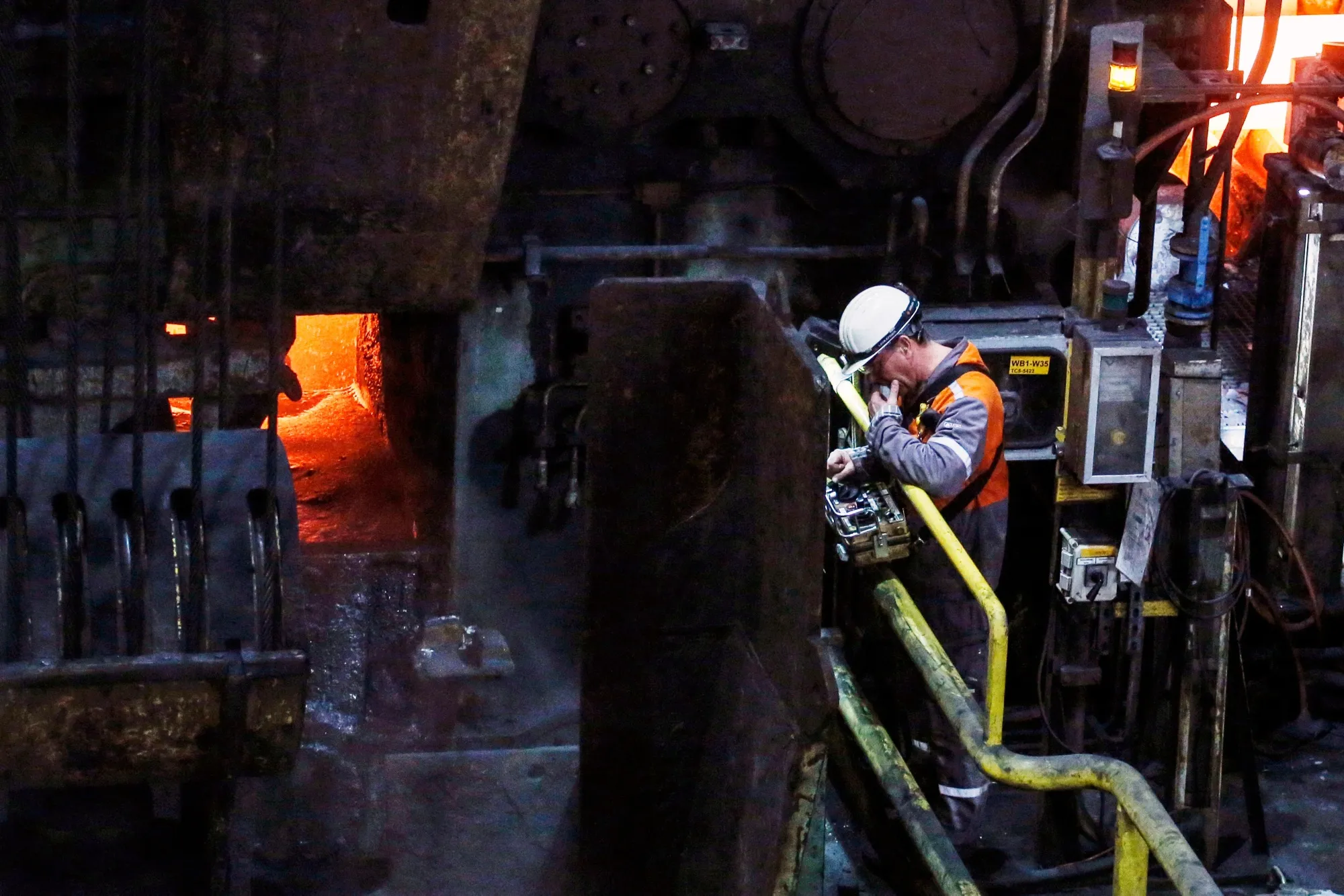 A worker in a rolling mill at the ArcelorMittal SA Ghent steel plant in Ghent, Belgium, earlier in March.