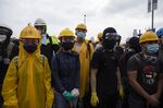 Protesters wear protective gear during a protest against a proposed extradition law in Hong Kong, China. 