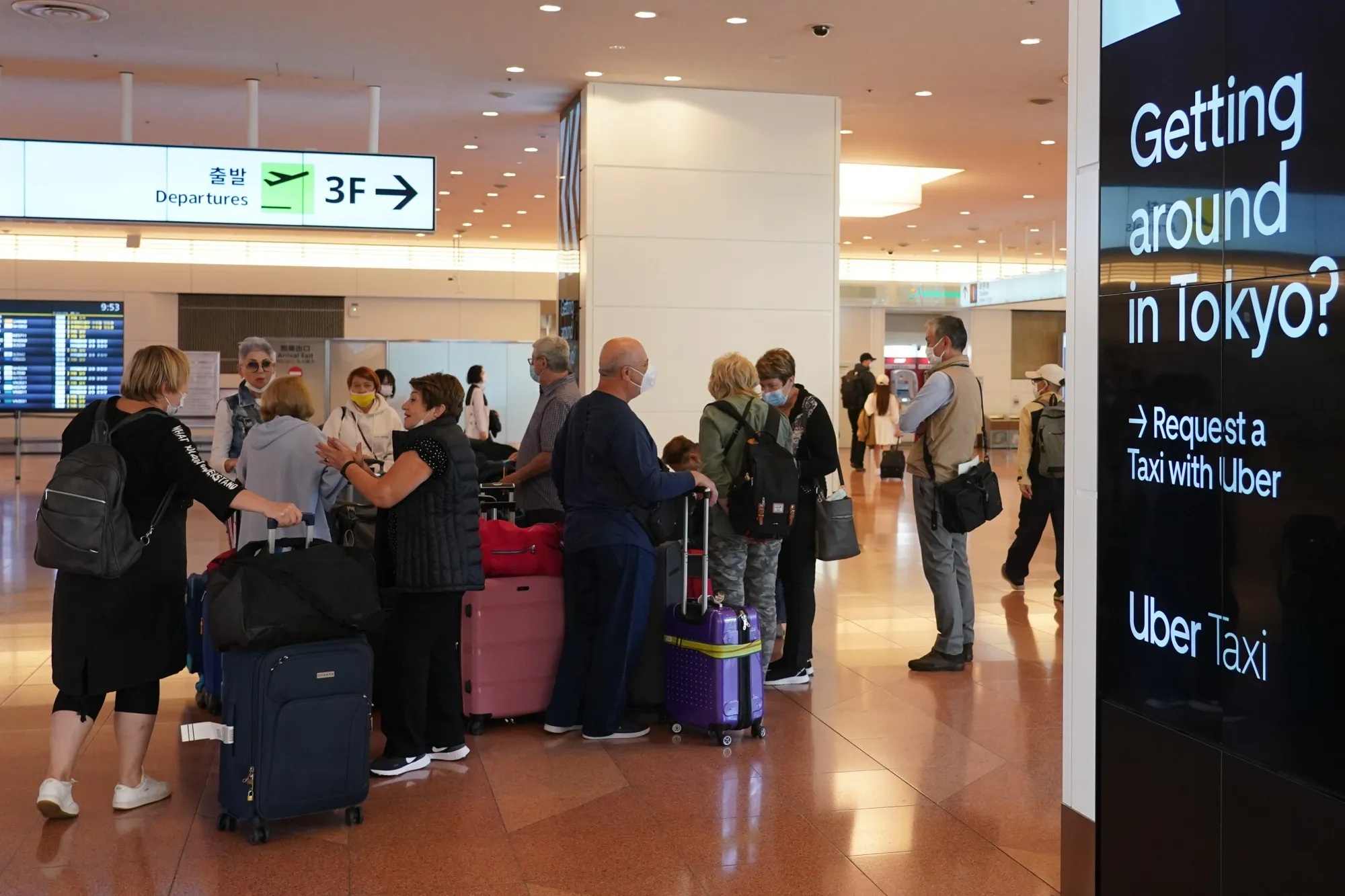 Passengers gather in the arrival lobby of Haneda Airport.&nbsp;