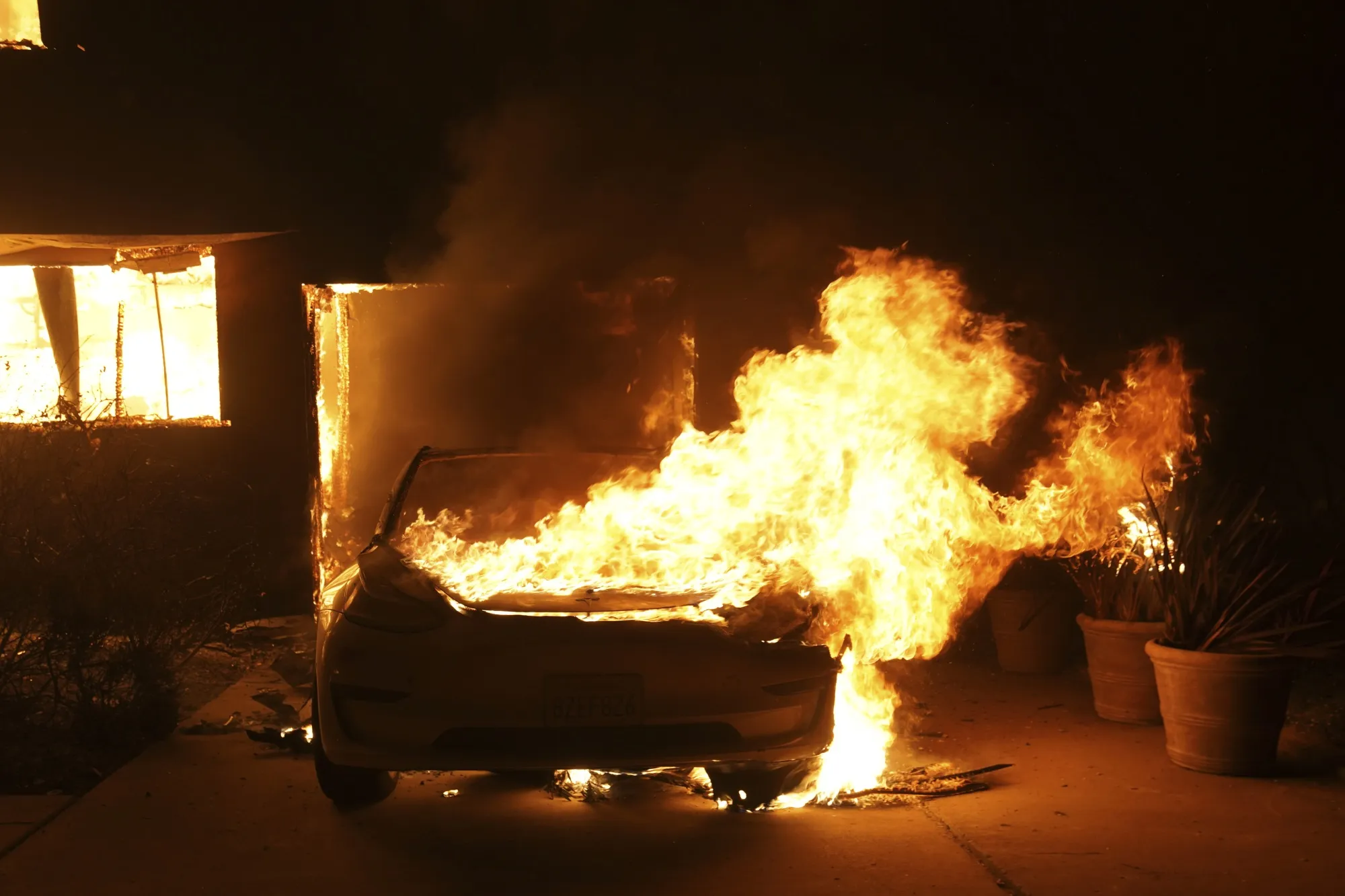 A Tesla is destroyed due to the Palisades Fire on Jan. 8.