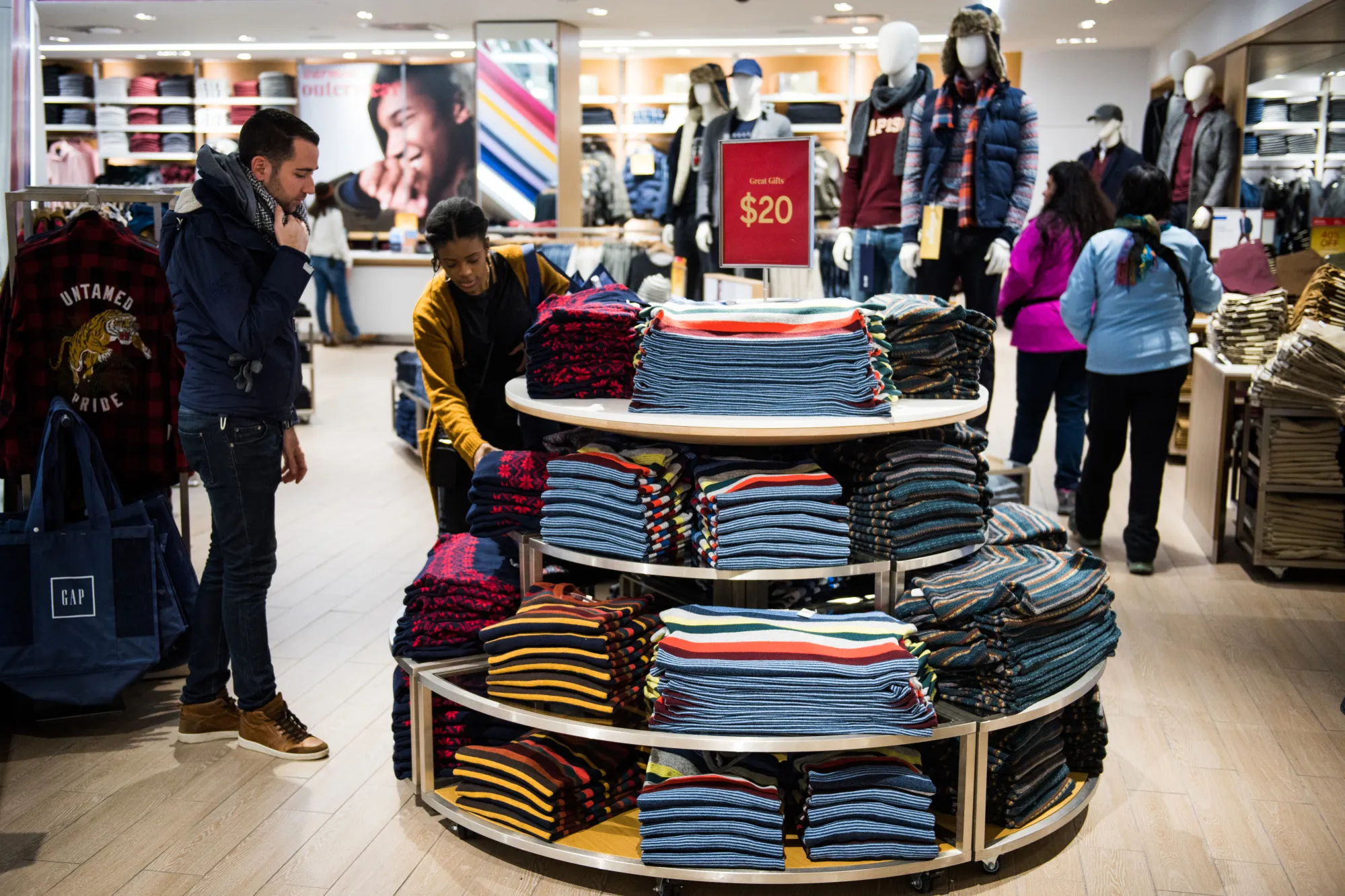 An employee assists a customer at a store in New York, on&nbsp;Dec. 13.