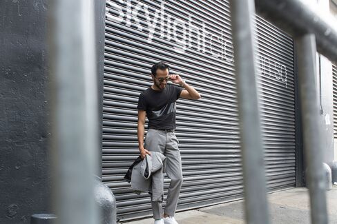 Moti outside Skylight Clarkson Square, the official venue of NYFWM, in a custom cotton suit by Born toTailor and T-shirt by Rag & Bone.