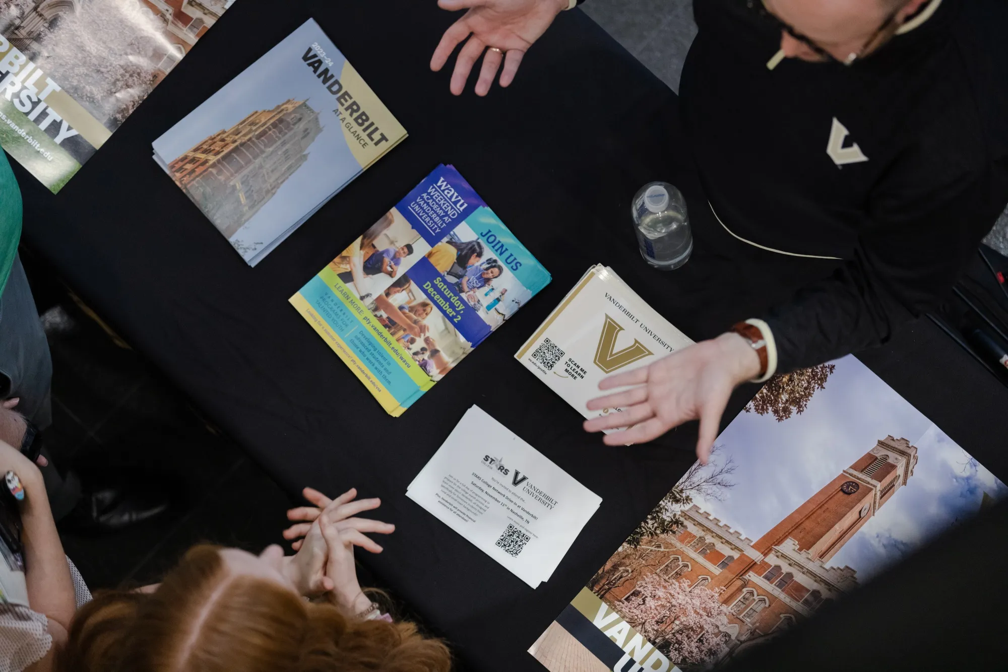 A Vanderbilt University assistant director of undergraduate admissions speaks with prospective students in Greeneville, Tennessee.