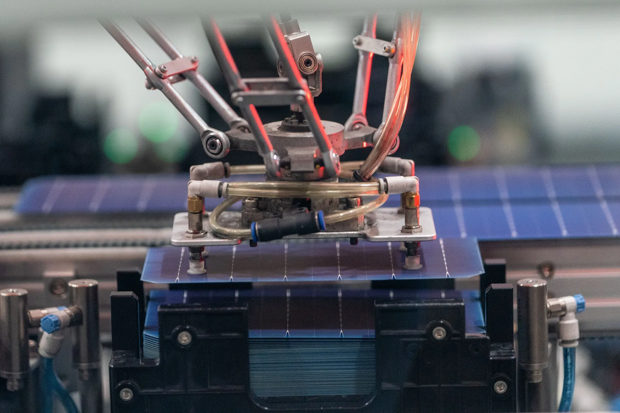 A machine sorts and stacks solar cells at a solar cell and module manufacturing facility in Dalton, Georgia.