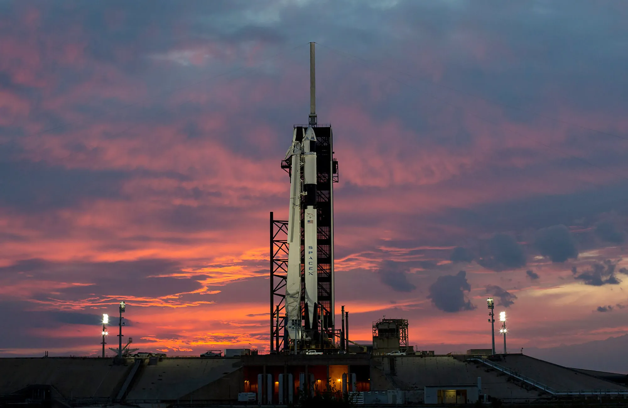A SpaceX Falcon 9 rocket with the company's Crew Dragon spacecraft onboard .