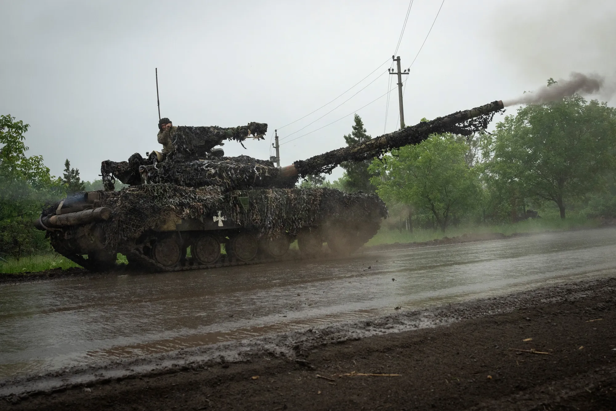 Ukrainian tank fires toward Russian positions at the frontline near Bakhmut on&nbsp;Tuesday.