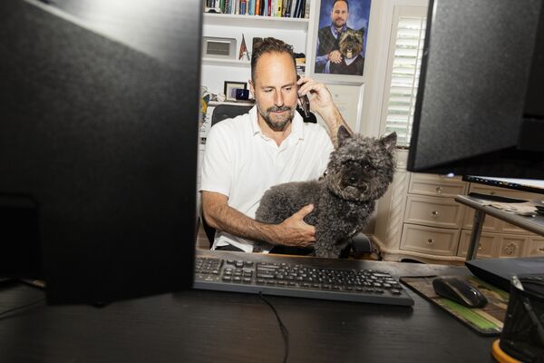 With His Pet Dog Parker, He Lures Billions to Risky ETFs From Home