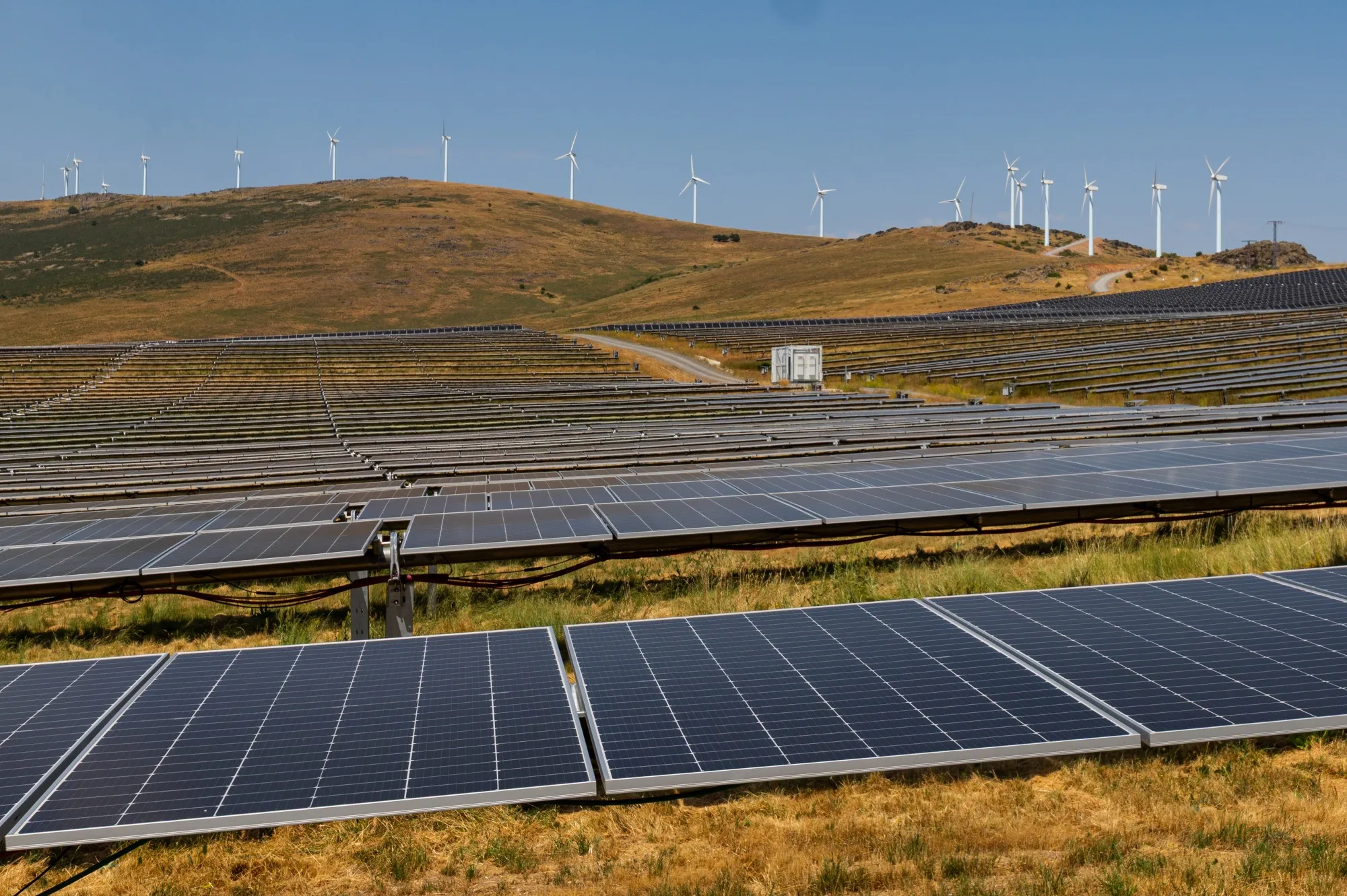 Solar panels&nbsp;and wind turbines on land in Avila, Spain.