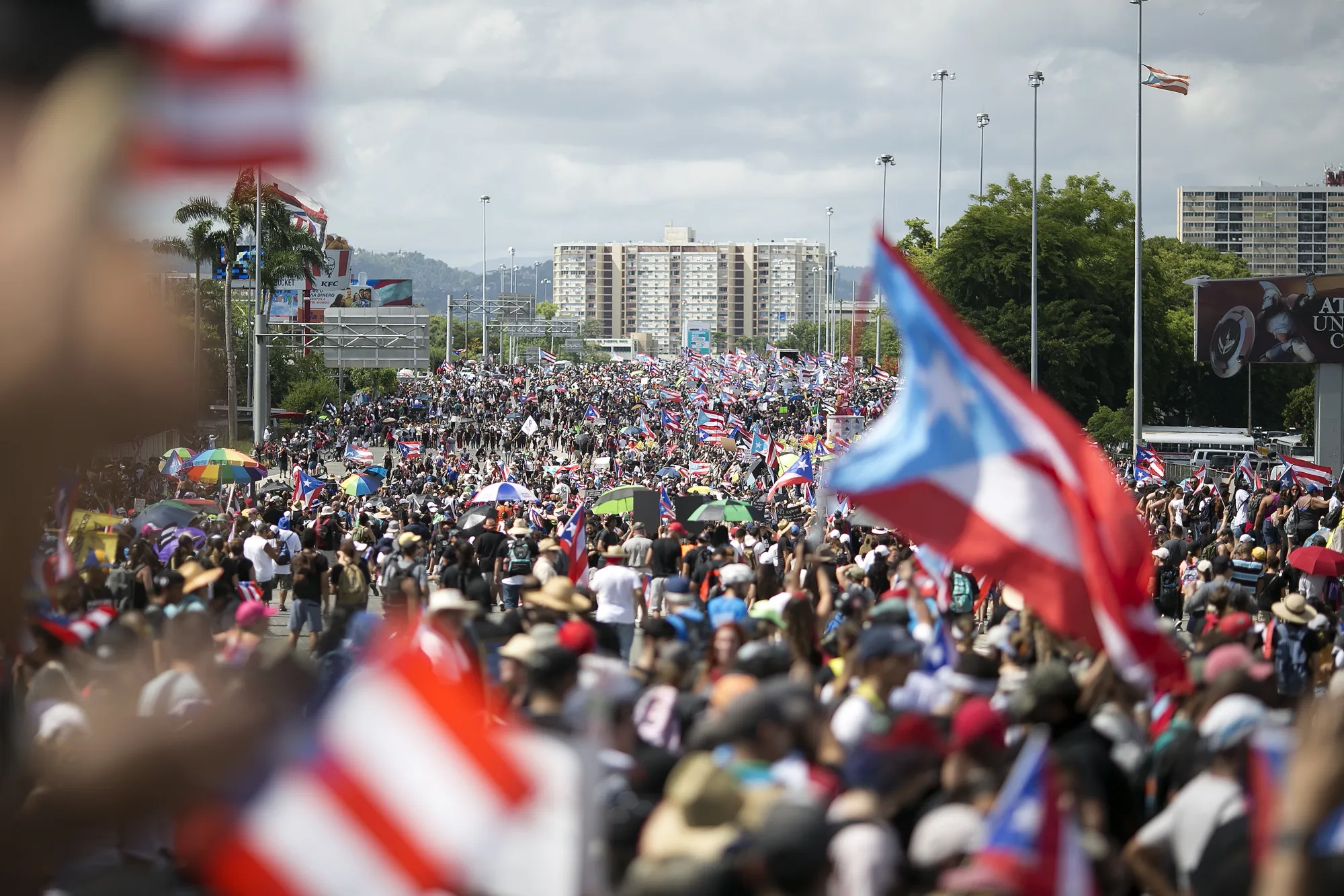 Demonstrators march on a highway blocking traffic during a protest in San Juan, Puerto Rico on July 22.