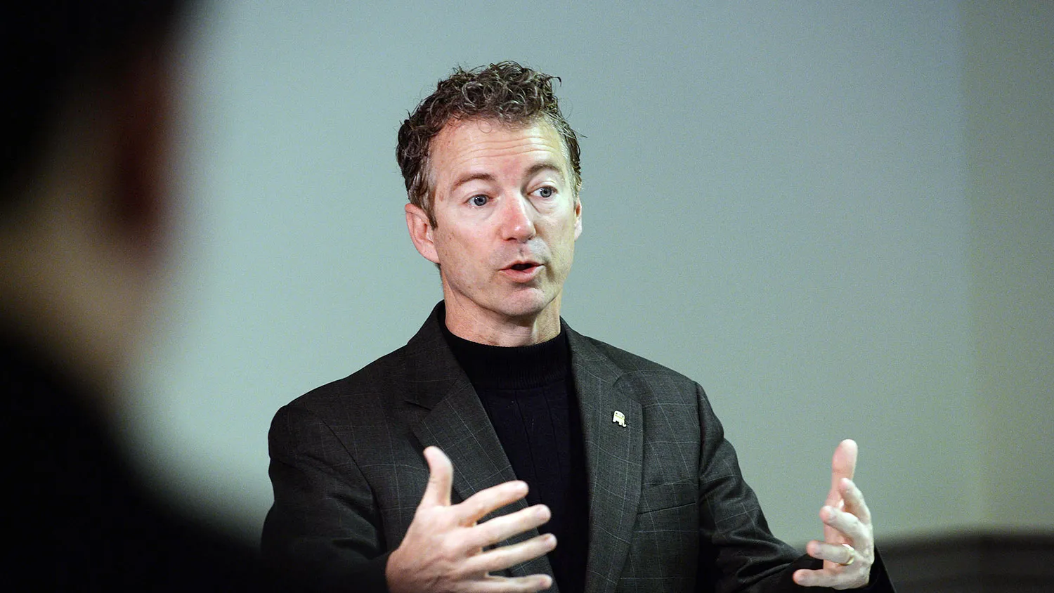 U.S. Senator Rand Paul (R-KY) speaks in a back room at Pink Cadillac Diner prior to meeting potential voters on March 21, 2015 in Rochester, New Hampshire.
