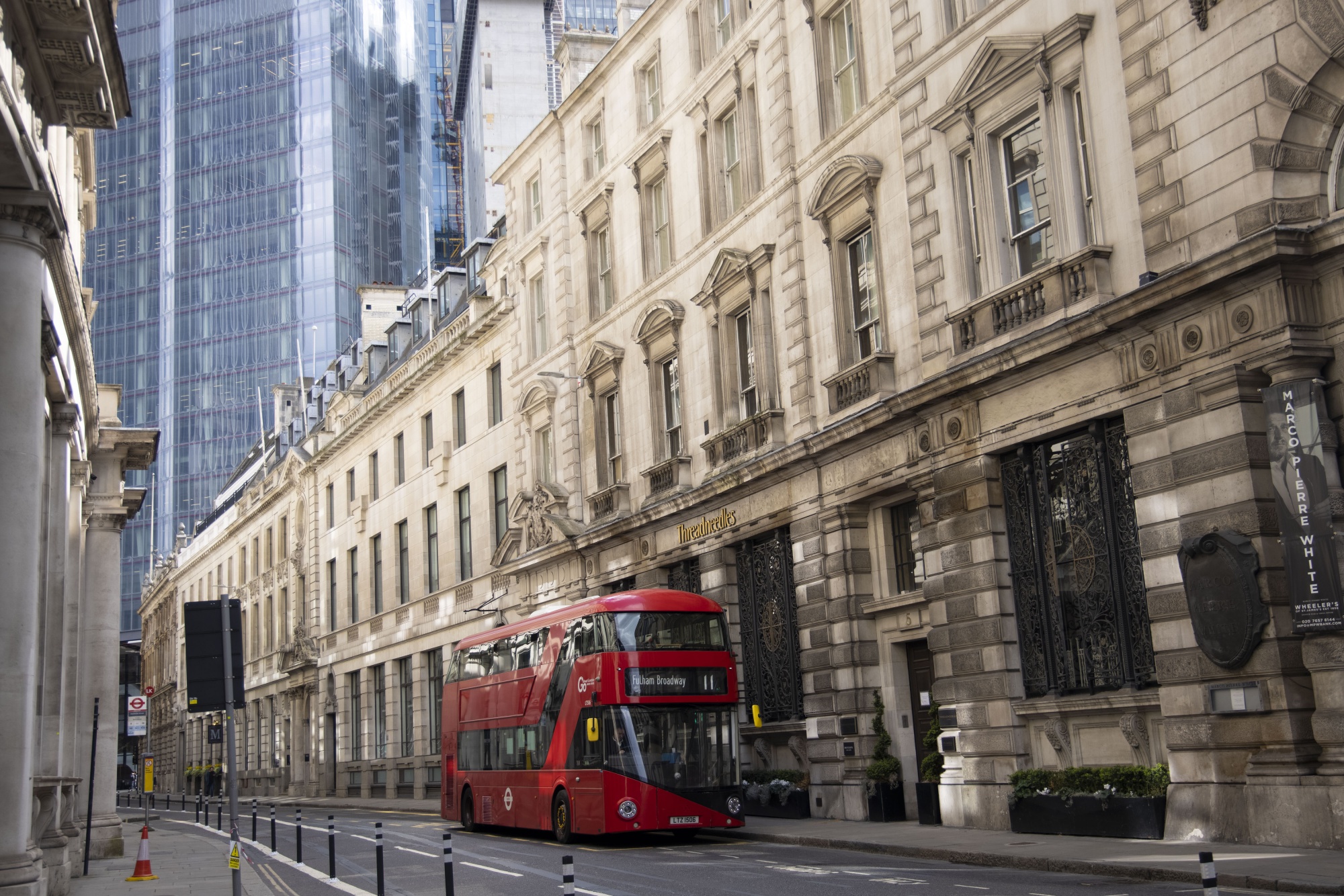 A bus travels along an empty street in the City of London, U.K., on April 13.