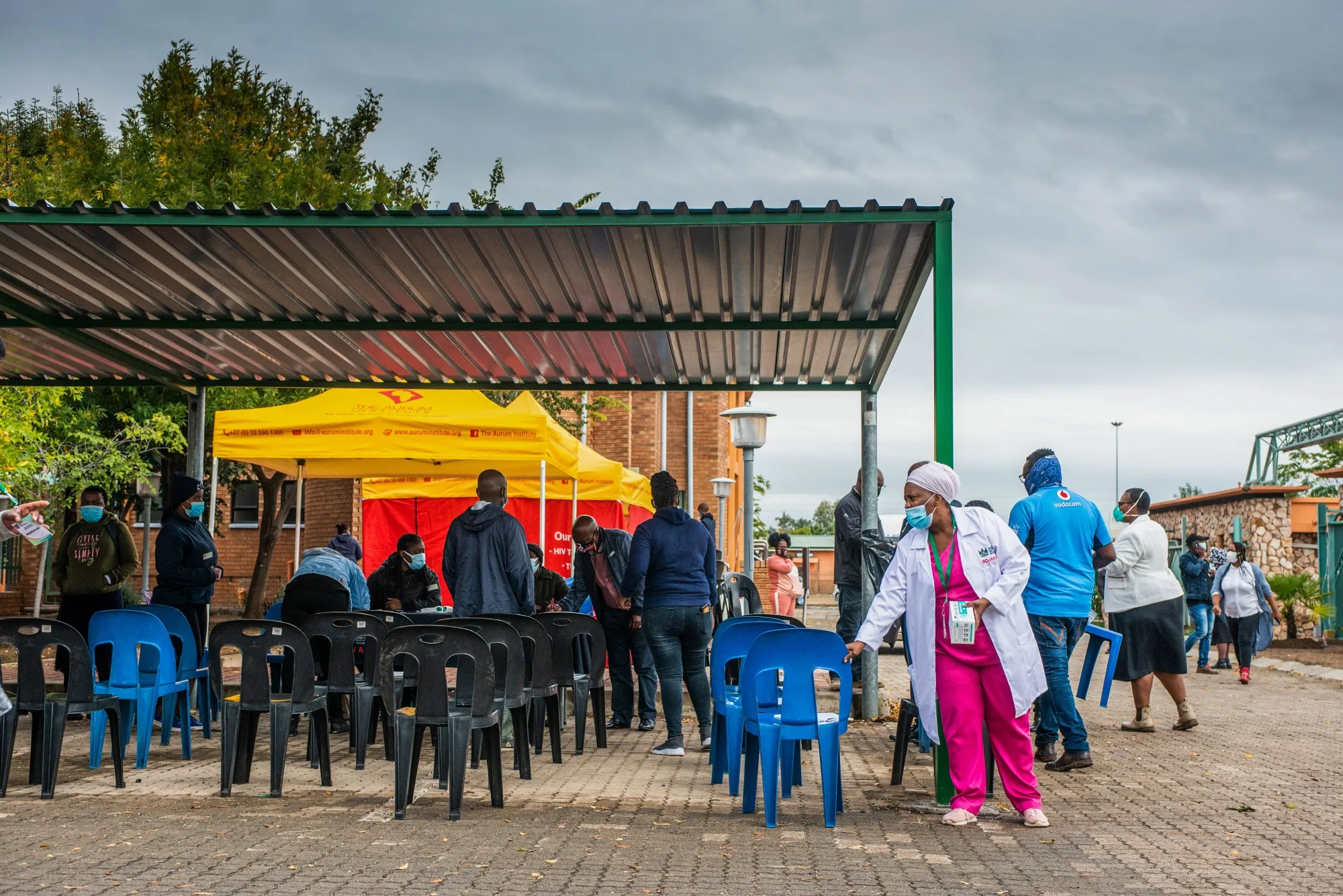 A health worker arranges seating at a Covid-19 vaccination program registration tent in Brits, South Africa on April 30.