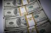 Stacks of U.S. $100 bills are arranged for a photograph in New York, U.S., on Thursday, Feb. 7, 2013. The U.S. dollar advanced in trading today to the highest in almost three weeks against a basket of major currencies.