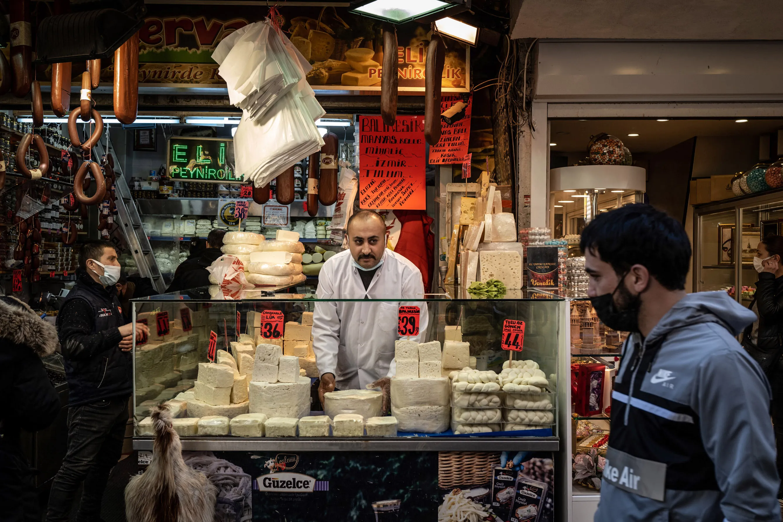 A cheesemonger looks out from his stall near Spice Bazaar in Istanbul.&nbsp;