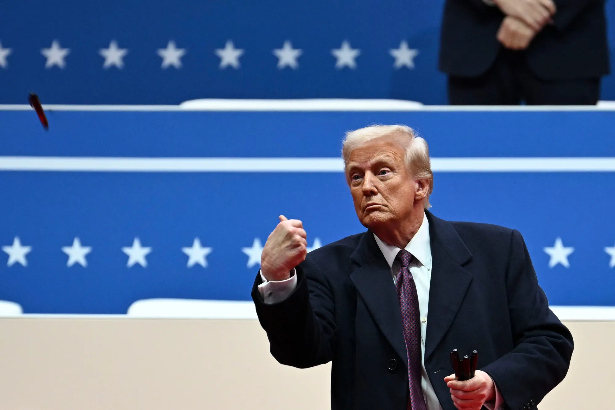 Donald Trump tosses a marker after signing executive orders during the presidential inauguration parade&nbsp;in Washington, DC, on Jan. 20.