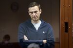 Alexei Navalny stands in a cell during a hearing in Moscow on Feb. 12.