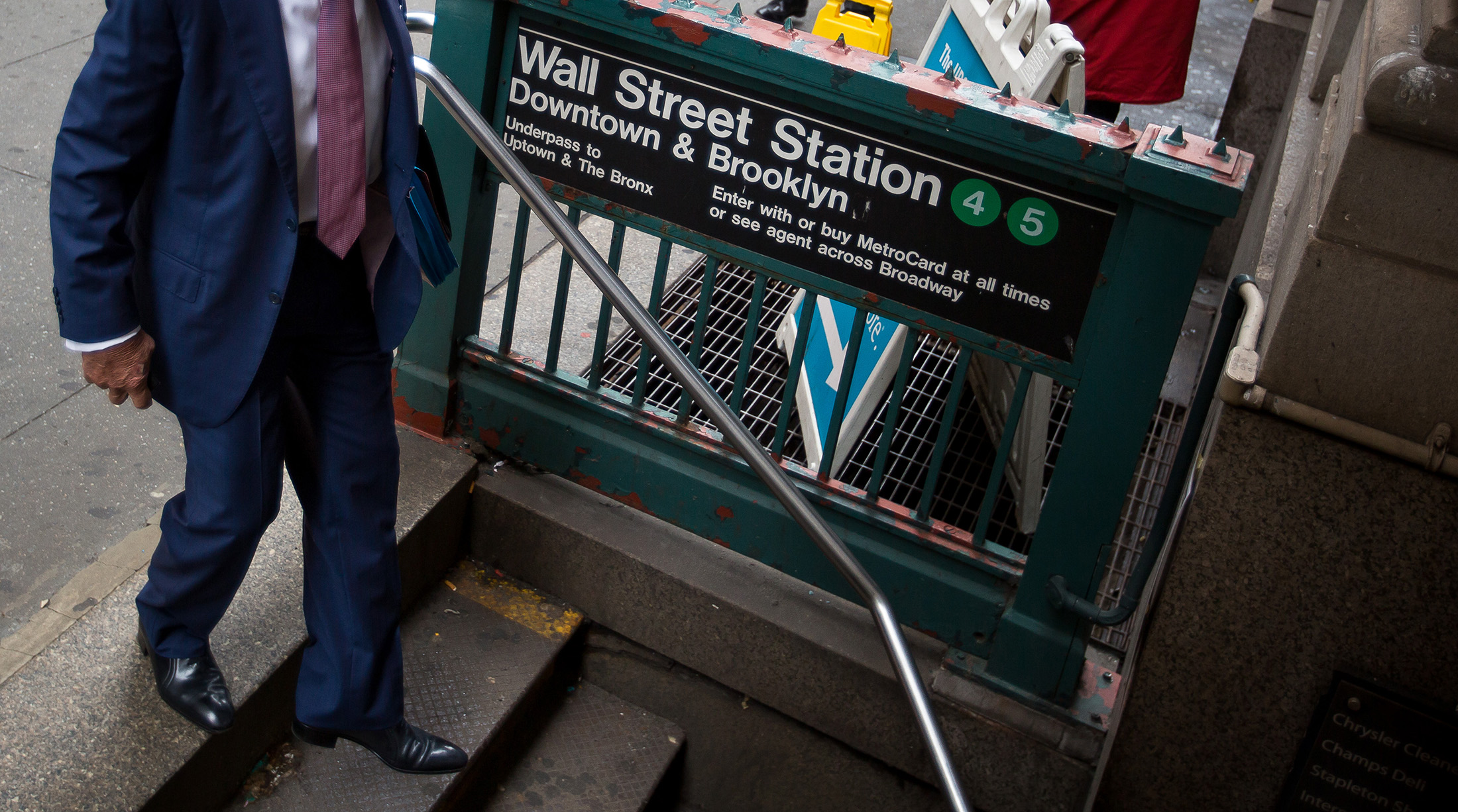 A man enters the Wall Street subway station near the New York Stock Exchange.
