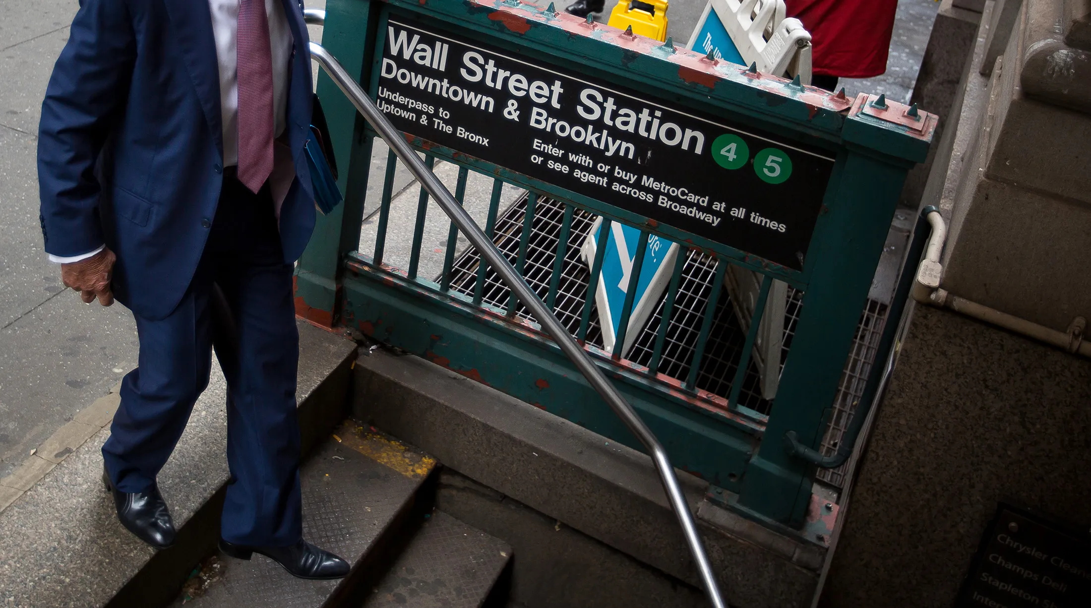 A man enters the Wall Street subway station near the New York Stock Exchange.

