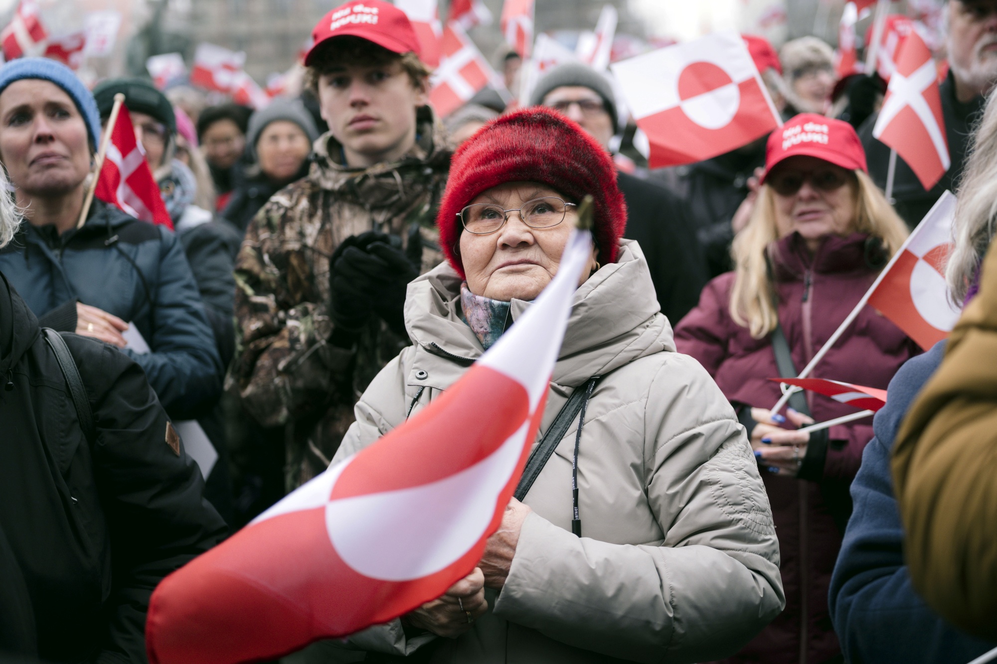 Protesters hold Greenland flags during a demonstration in Copenhagen, Denmark, on Saturday, Jan. 17, 2026. Thousands of people took to the streets across Denmark to protest US President Donald Trump's ambitions to take control of Greenland, underscoring the deep unease over the future of the Arctic island. Photographer: Nichlas Pollier/Bloomberg