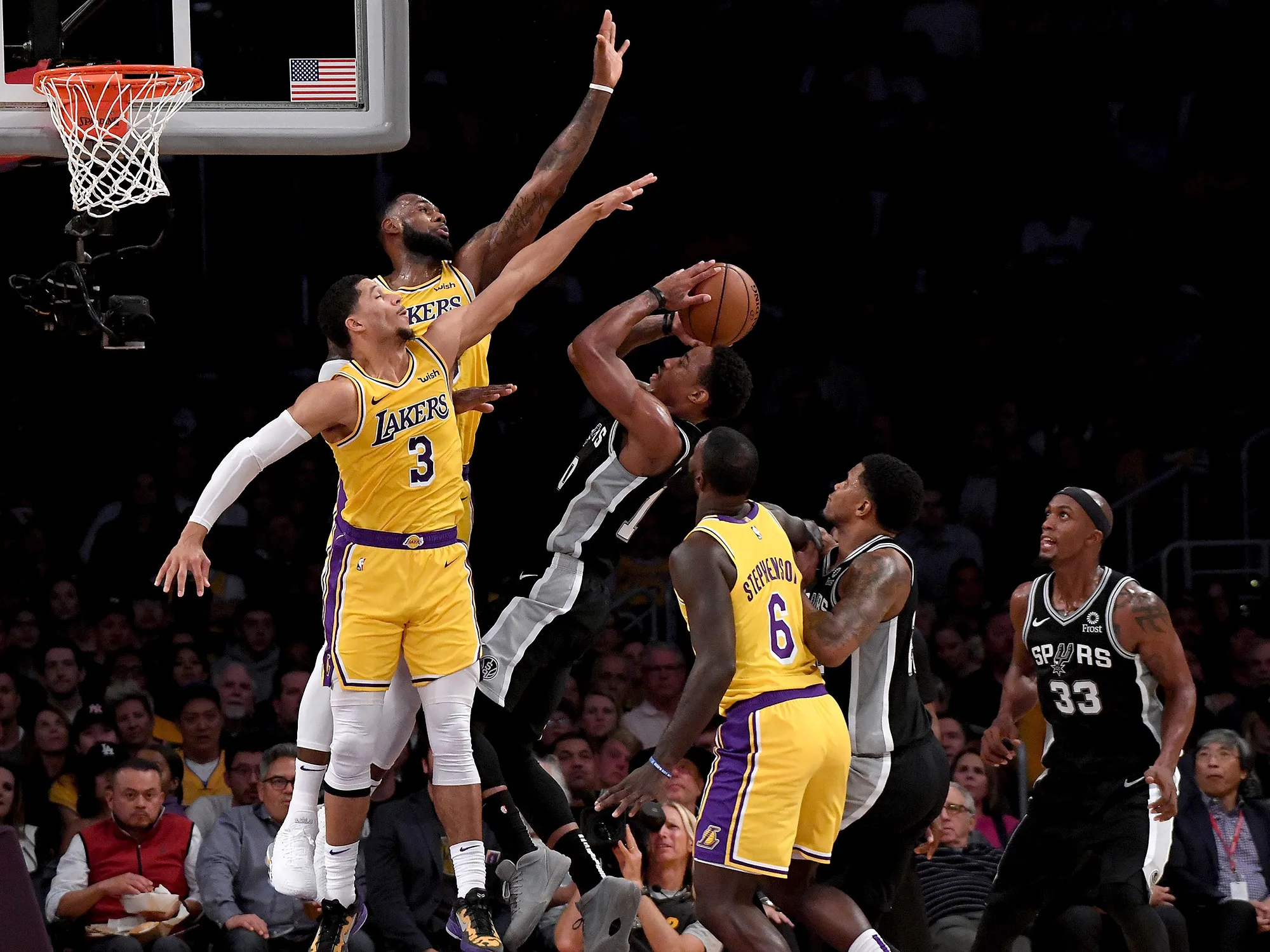 DeMar DeRozan of the San Antonio Spurs has his shot contested by Josh Hart&nbsp;and LeBron James&nbsp;of the Los Angeles Lakers&nbsp;on Oct.&nbsp;22, 2018.