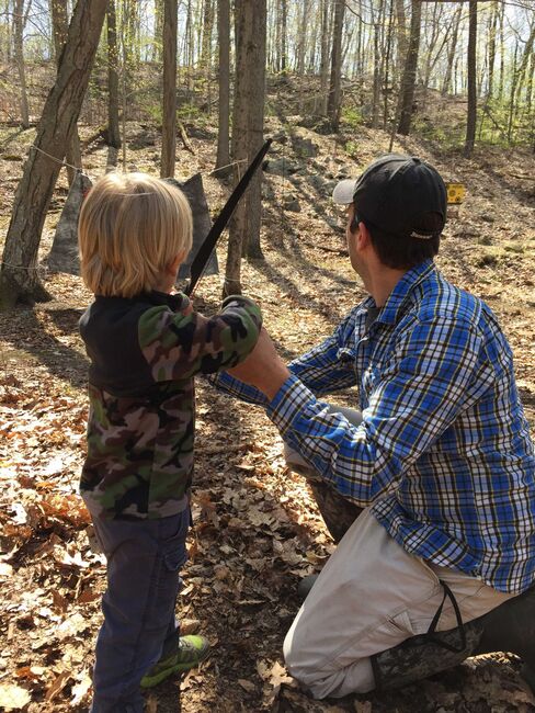Donald Trump, Jr., with his son Tristan at the archery range.